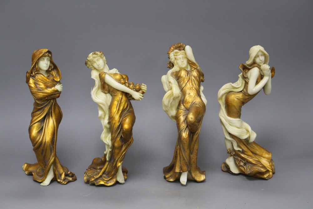 A set of four Italian gilt resin figures of maidens representing The Seasons, stamped STT, height 20cm